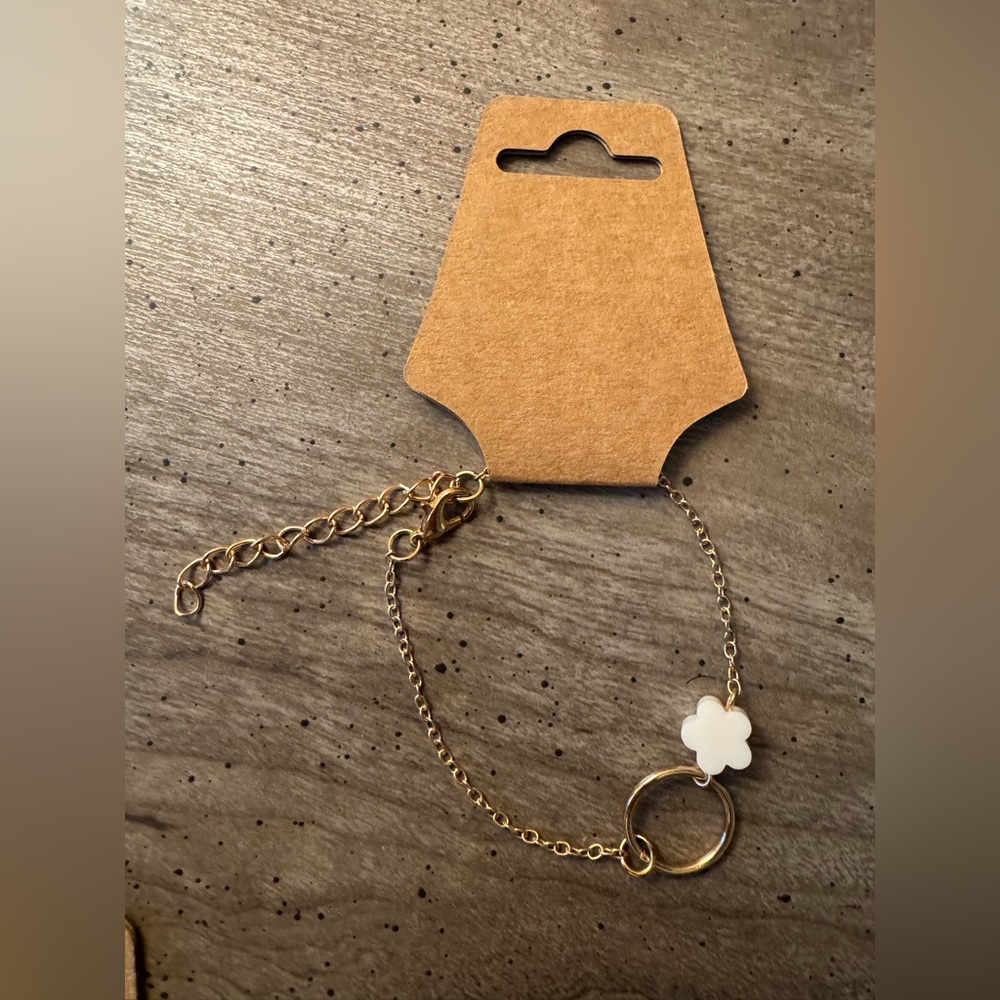 Gold Tone Chain Bracelet with White Flower Charm